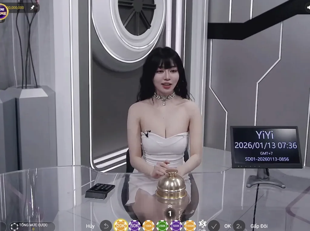 Dealer nữ chia bài trong sảnh live casino TP tại LC79 với giao diện studio hiện đại